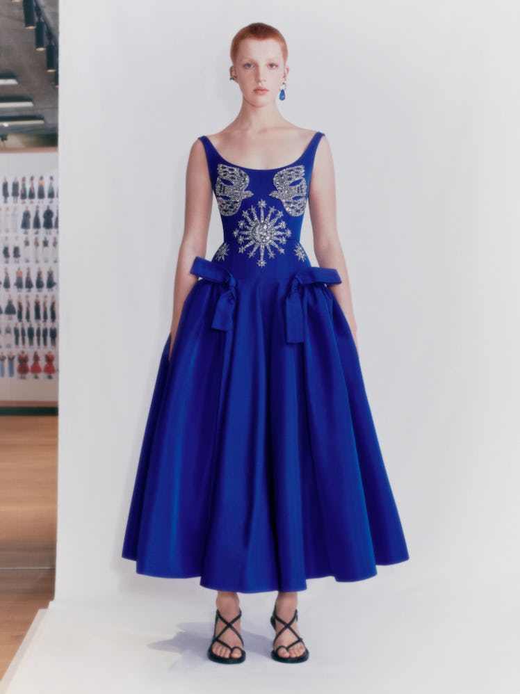 A model in a blue Alexander McQueen dress