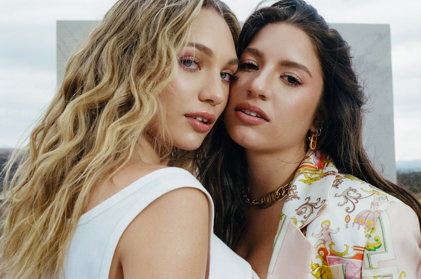 A closeup of Elite Daily cover stars and sisters Maddie and Kenzie Ziegler as they pose together out...