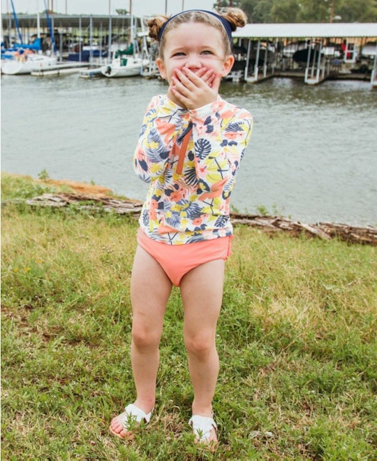 toddler girl in a bathing suit
