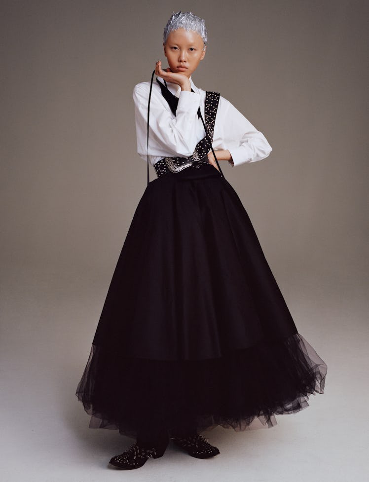 Model Jan Baiboon wears a Prada romper and skirt; Richard Quinn crinoline; Amber W. Smith neckpiece;...