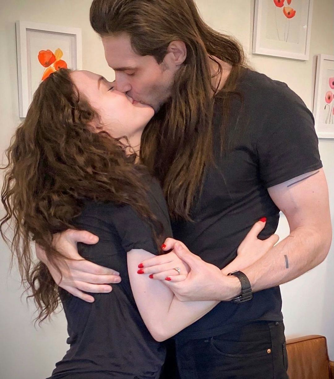 Kat Dennings and Andrew WK kissing. 