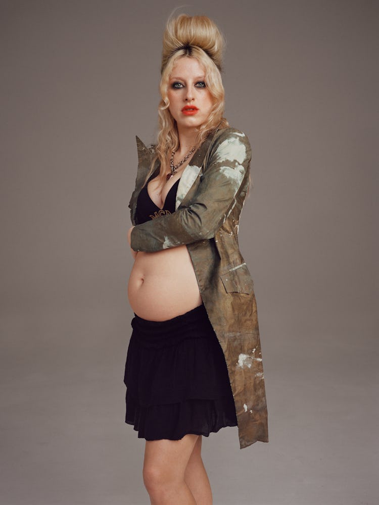 Model Harriet Verney wears a vintage Alexander McQueen jacket; MCM bra; Alexander McQueen necklace; ...