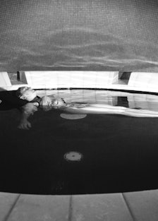 woman floating in a sensory deprivation pool