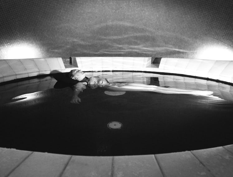 woman floating in a sensory deprivation pool