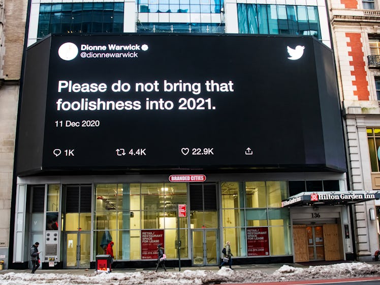 Dionne Warwick's tweet about not bringing foolishness into 2021, on a big screen on the street 