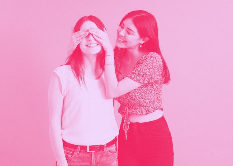 A girl covering her BFF's eyes with hands