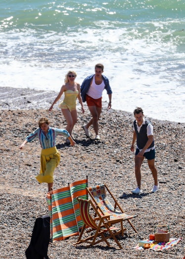 Harry Styles and Emma Corrin on the beach