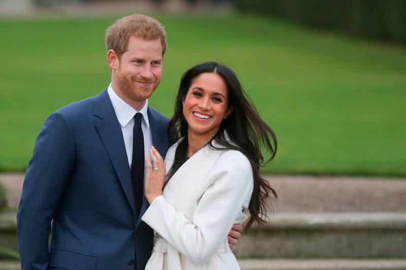 Britain's Prince Harry and his fiancée US actress Meghan Markle pose for a photograph in the Sunken ...