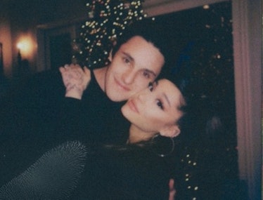 Dalton and Ariana hugging in front of a Christmas tree
