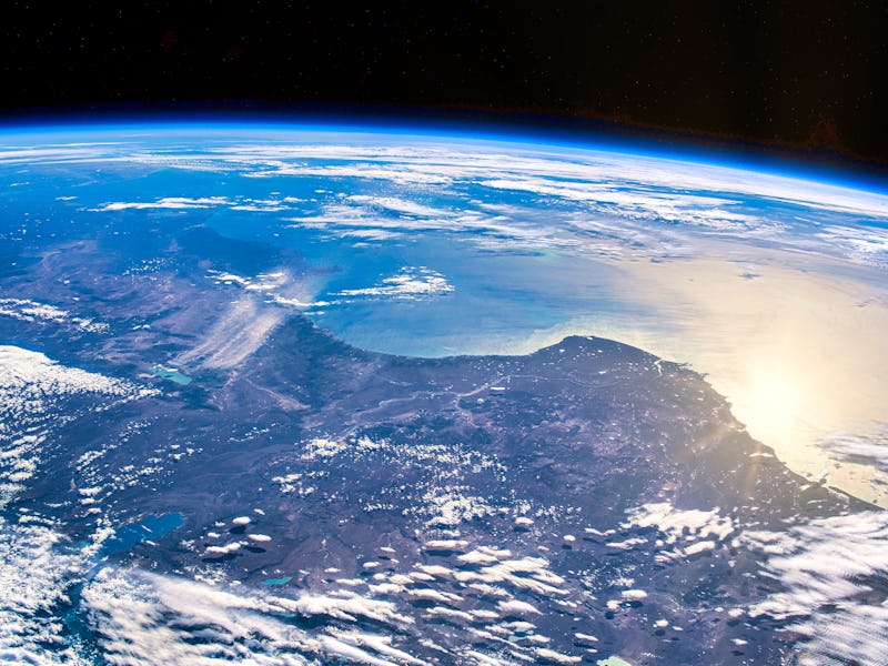 Sunlight reflects off the Earth's surface