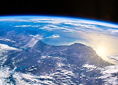 Sunlight reflects off the Earth's surface