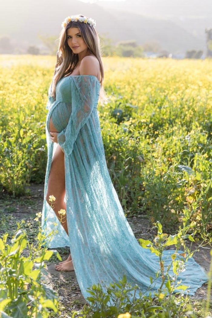 woman wearing beautiful maternity gown for photoshoot