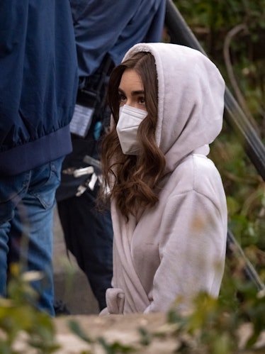 Lily Collins wearing a robe