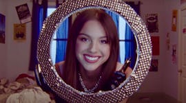 Olivia Rodrigo goes glam in "good 4 u" music video, leading to viral TikTok challenge.