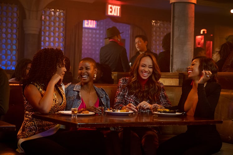 four friends sitting at a table