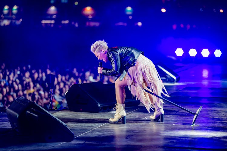 Pink singing on stage in front of audience 