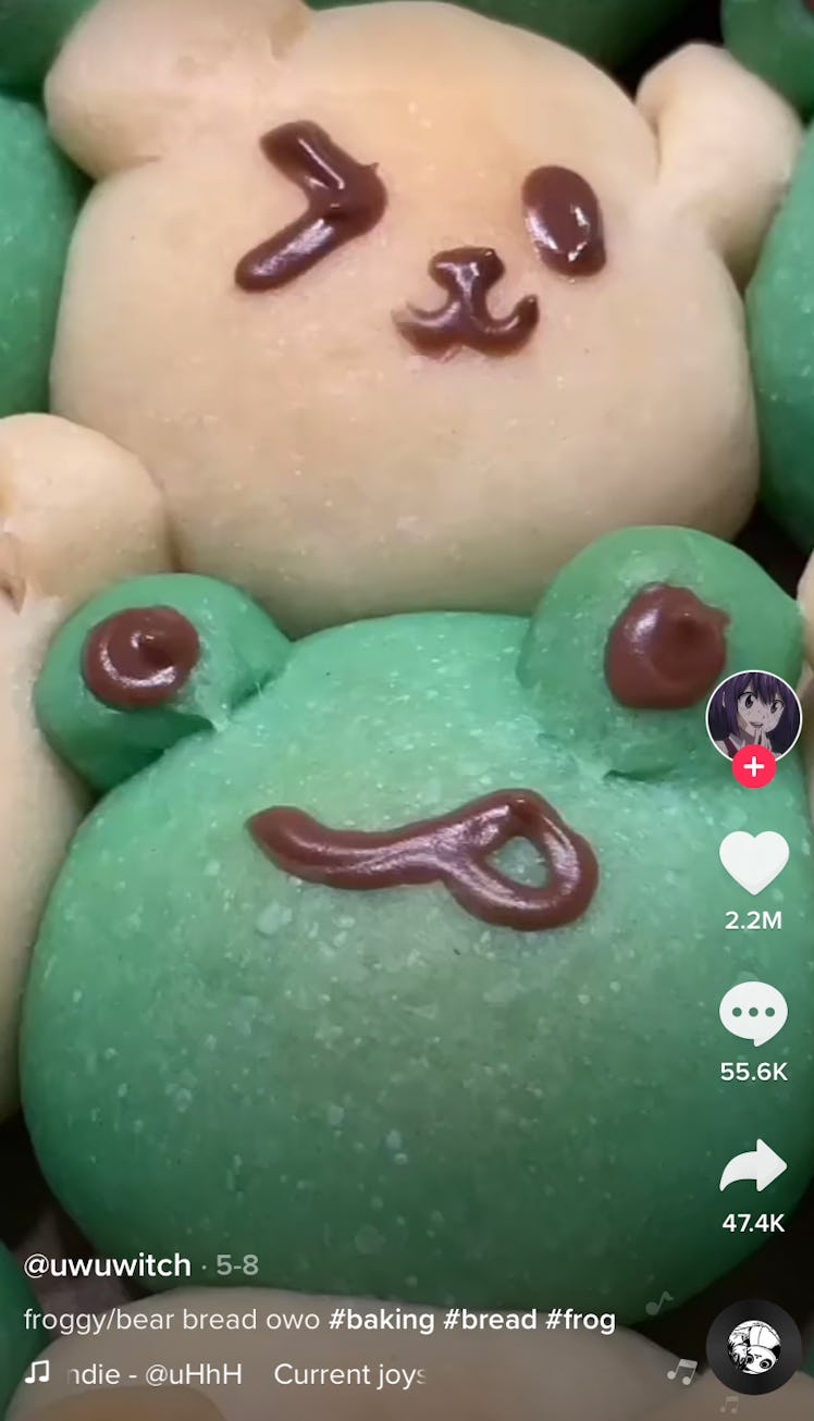 Some adorable bear and frog bread from TikTok sit in a pan. 
