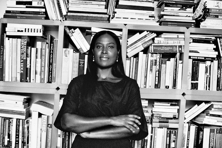 Nicola Vassell standing in front of a book shelf 