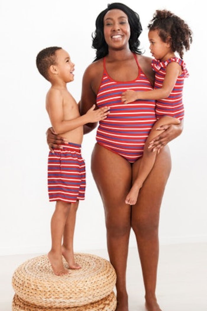 a mom and two kids wearing matching swimsuits