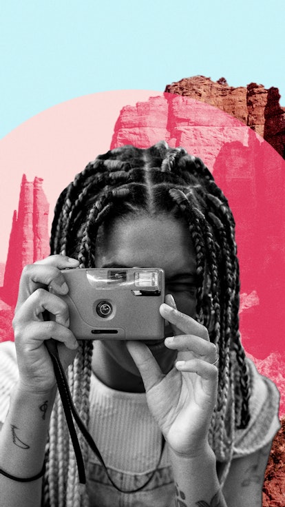 Young woman snapping a picture in front of one of the most Instagram-worthy pink places in Arizona.