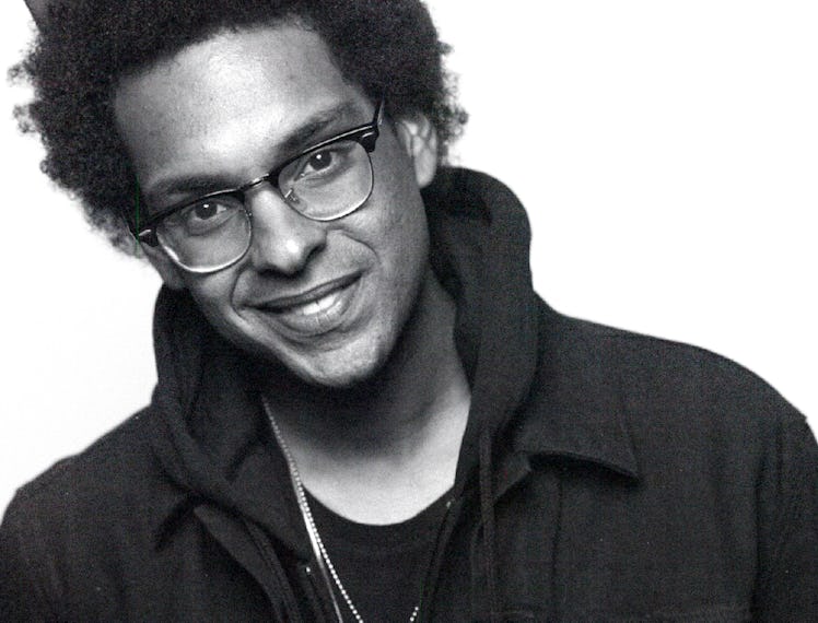 Yassir Lester wearing a hoodie and hat