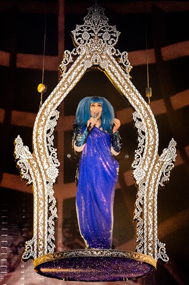 Cher performing in blue