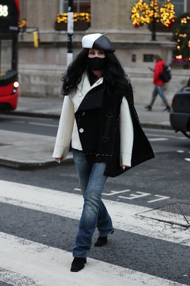 Cher crossing a street