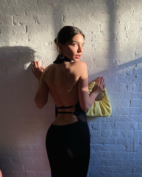 Emily Ratajkowski wears white Esclub sneakers from Aldo while taking her 'brunch buddy', two-month-o...