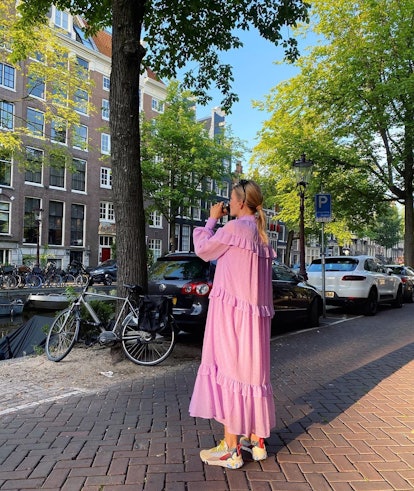 Karoline Dall paired her maxi pink summer dress with colorful sneakers.