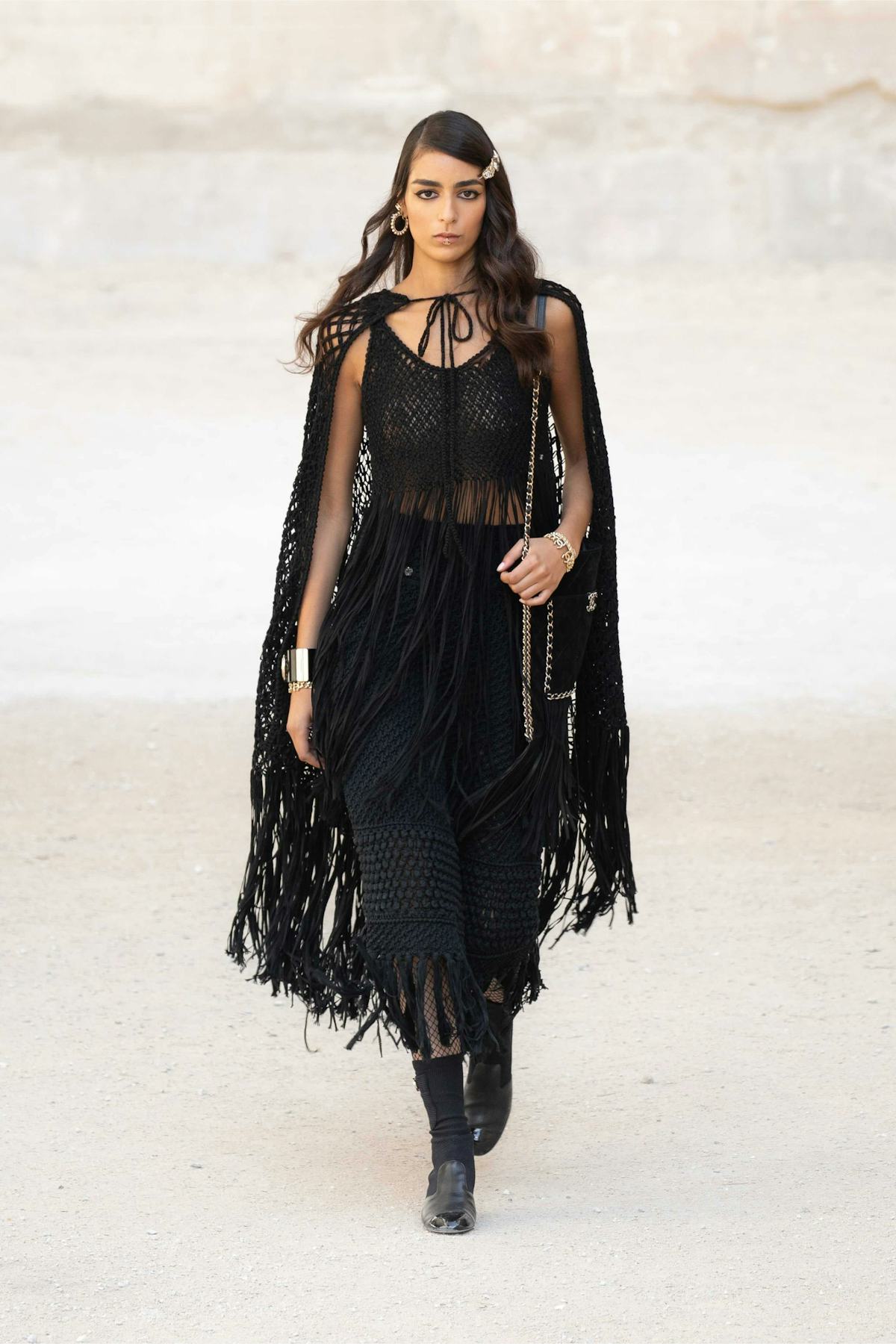 model in sheer black Chanel cape and dress