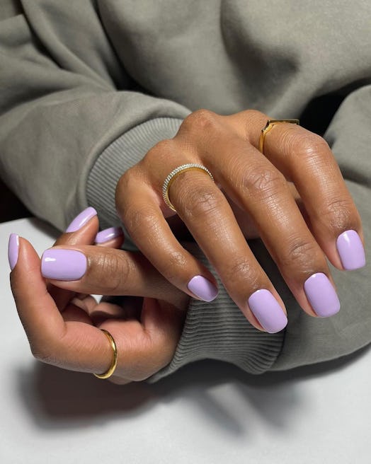Woman showing her classic summer lavender nail polish 