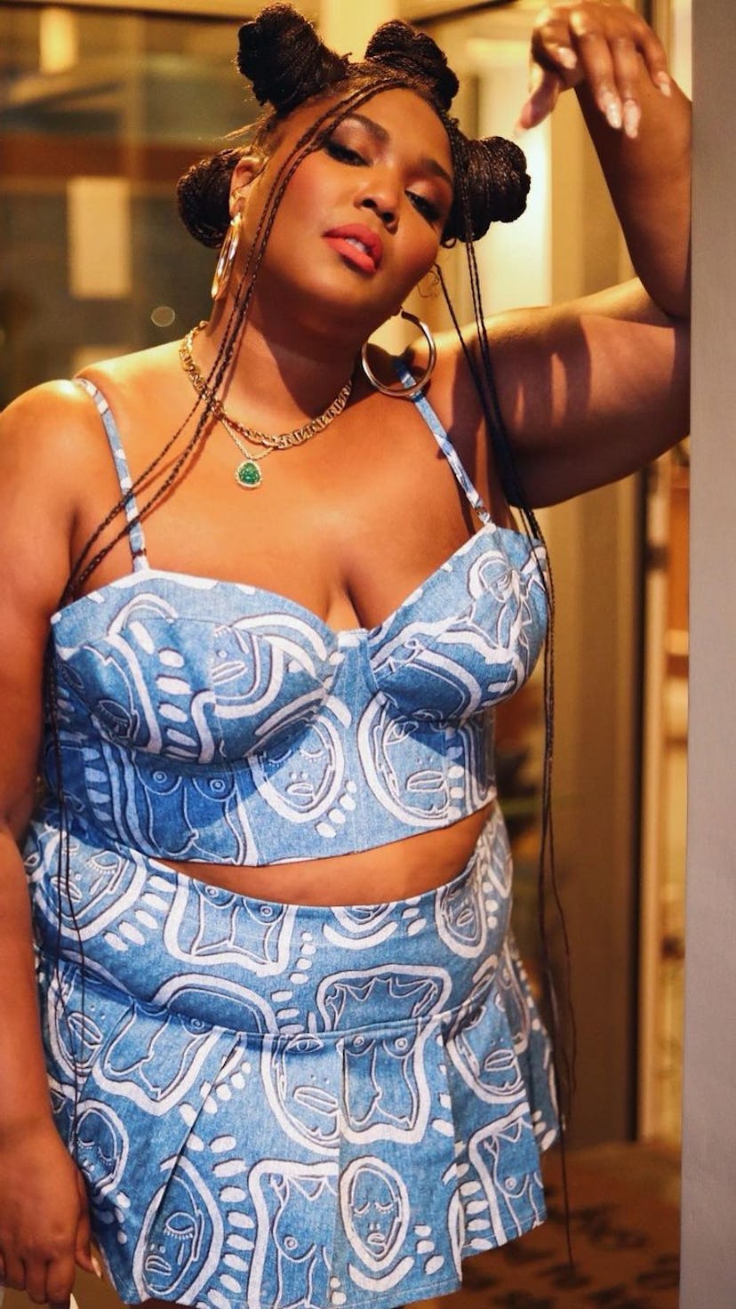 Lizzo is one of the Best Dressed Celebrities this week. Here, she rocks a matching crop top and skir...