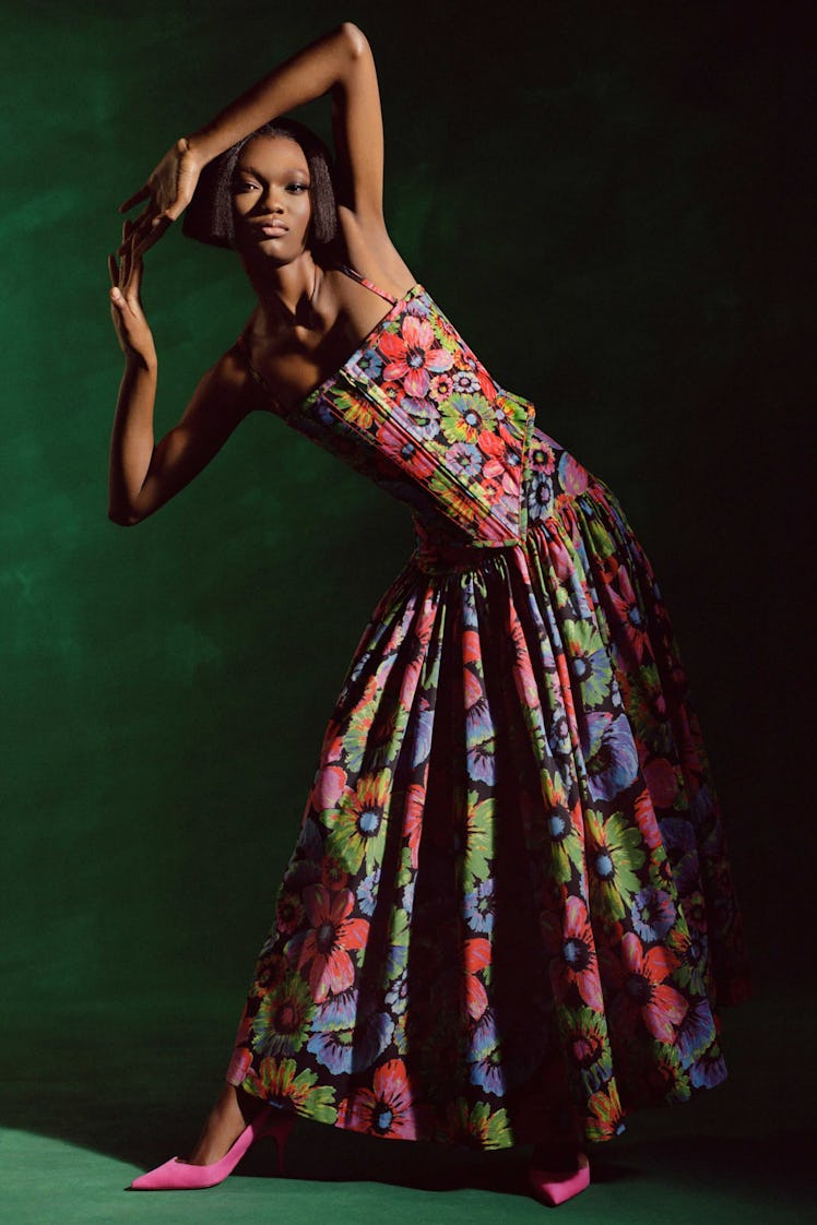 A female model wearing a floral dress