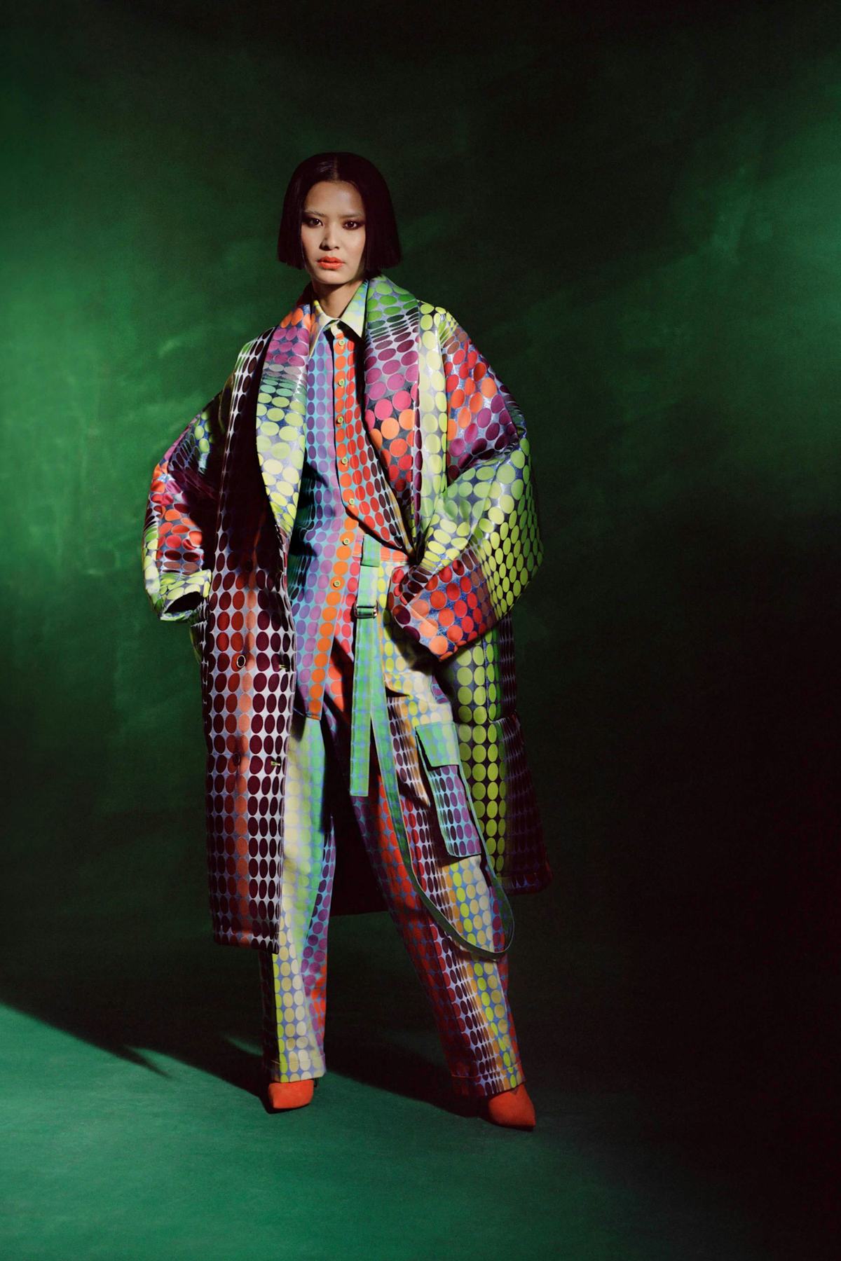 Model in colorful coat and matching set