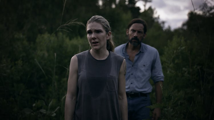 Lily Rabe (Emma), Enrique Murciano (Peter Guillory) in a field, distraught