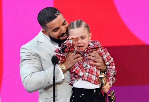 Drake, winner of the Artist of the Decade Award, and Adonis Graham speak onstage for the 2021 Billbo...