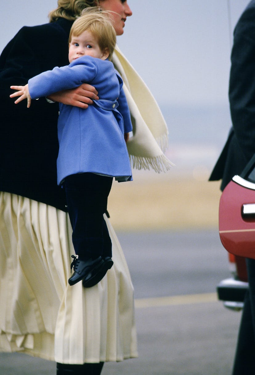 Diana, Princess of Wales carring Prince Harry in a blue coat at Aberdeen Ai