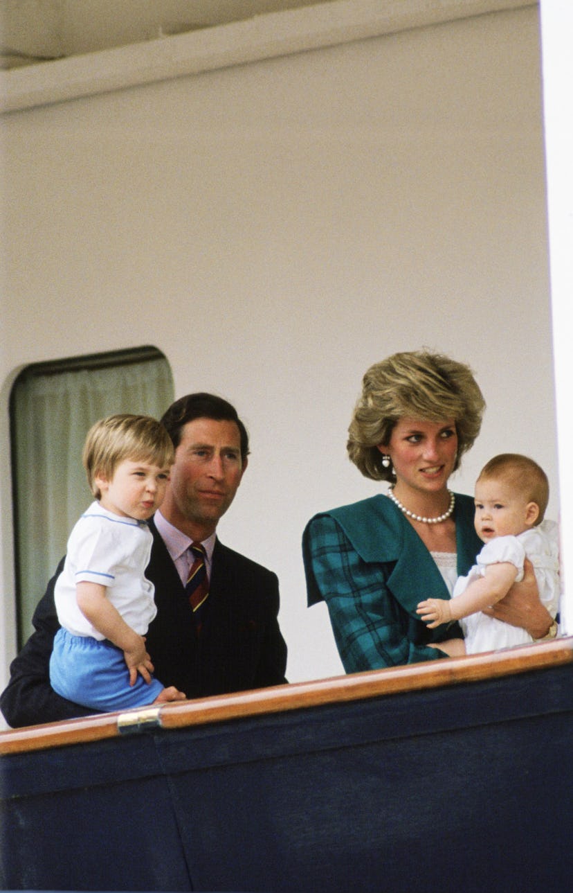 Prince Charles carrying Prince william and princess diana carrying prince harry