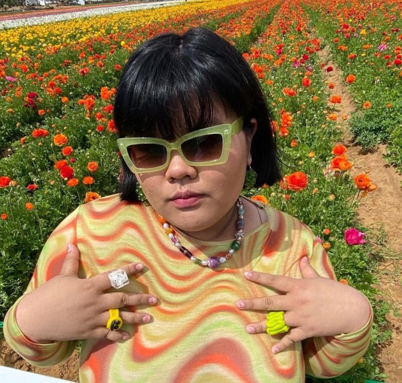 Fashion influencer and TikToker Amanda Quach showing off her personal style in a psychedelic outfit ...