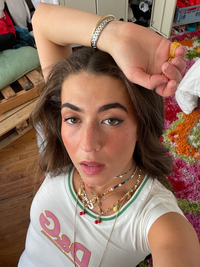 TikTok star Victoria Paris taking a selfie in a white vintage Dolce & Gabbana top and Betsey Johnson...