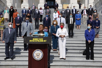 Rep. Karen Bass speaking on the George Floyd Justice in Policing Act, flanked by other House Democra...
