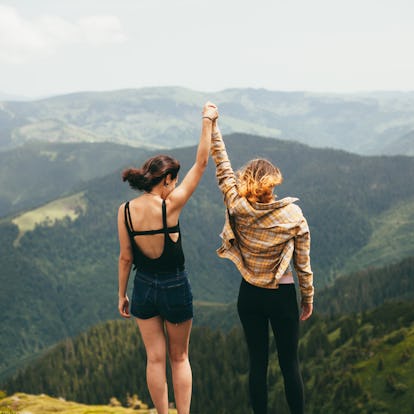 Young women in the mountains, ready to post on Instagram with a cute caption.