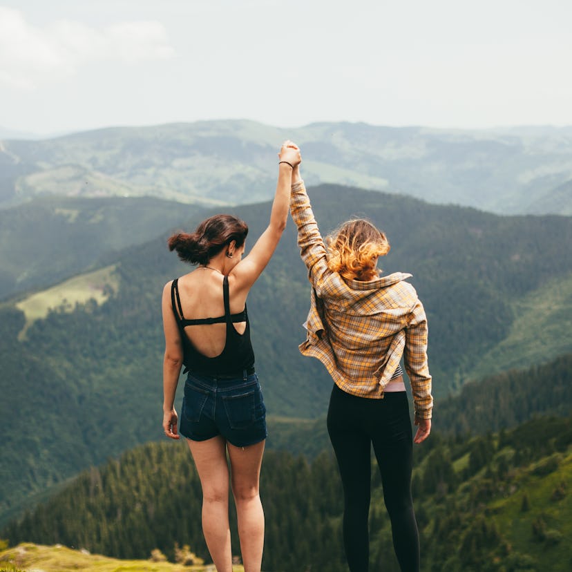 Young women in the mountains, ready to post on Instagram with a cute caption.