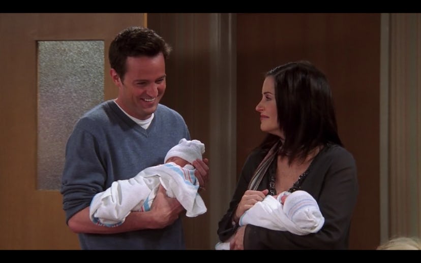 Chandler (Matthew Perry) and Monica (Courtney Cox) hold their twin babies in the finale of Friends.