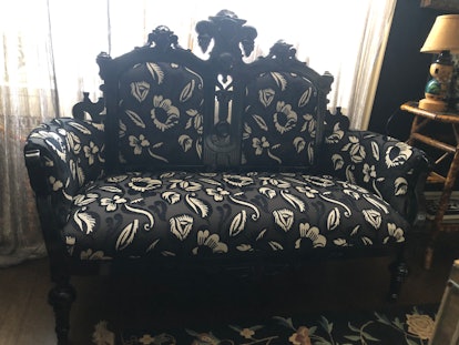 Black seater sofa in the home office room of Anna Sui