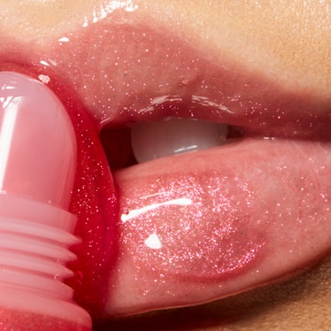 A close-up photo of e.l.f. Cosmetics' Jelly Pop Juicy Gloss being applied to lips.