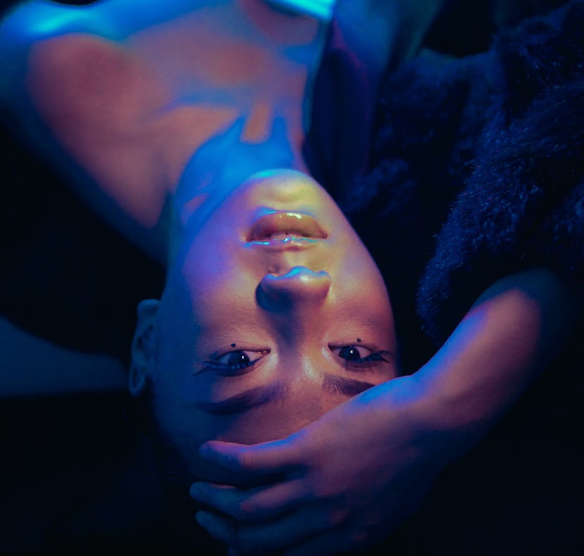 Young woman upside down amid Mercury retrograde spring 2021.