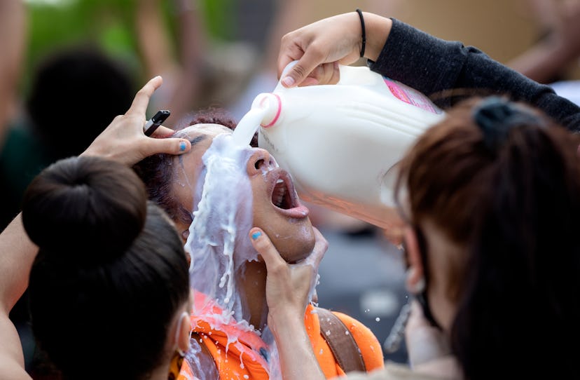 A protester being doused with milk after exposure to tear gas in Minneapolis