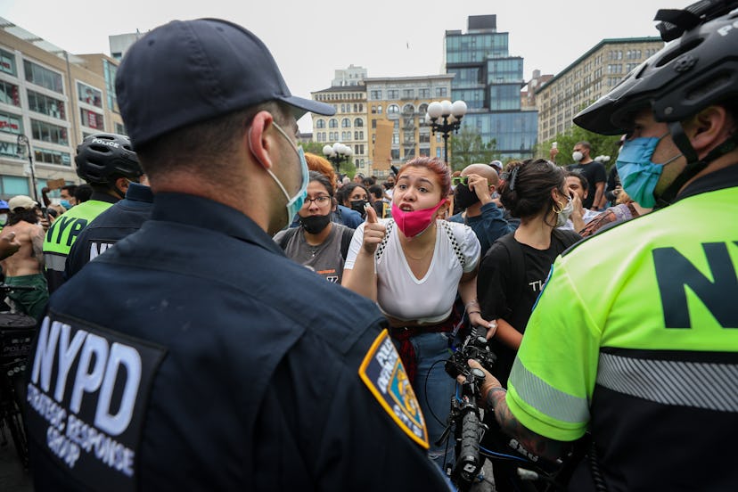 A protester confronting a police officer in New York City