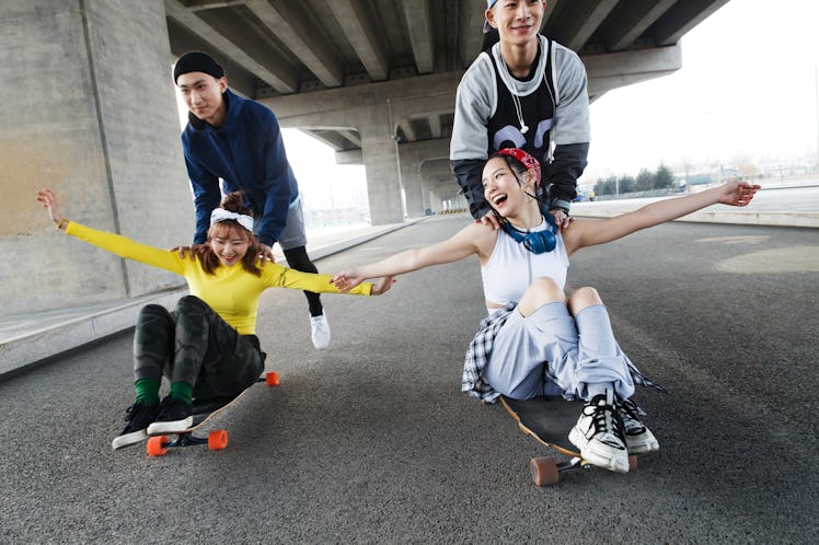 Young friends skateboarding on the best day in June 2021 for every zodiac sign.